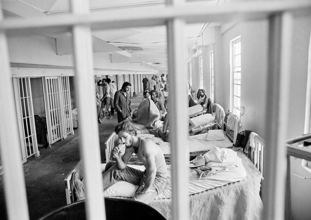 FILE - A prisoner lights a cigarette in the maximum security section of the Louisiana State prison at Angola, in December 1975. (AP Photo/Jack Thornell, File)