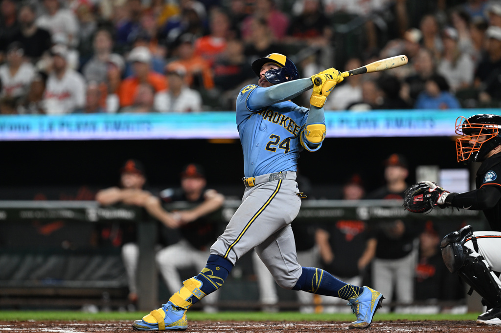 Milwaukee Brewers catcher William Contreras (24) follows through on a solo home run against the Baltimore Orioles in the fourth inning of a baseball game on Sunday, Sept. 20, 2026, in Baltimore. (AP Photo/Gail Burton)