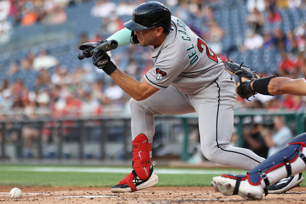 Arizona Diamondbacks' Adrian del Castillo lays down a sacrifice bunt during the second inning of a baseball game against the Washington Nationals, Friday, July 24, 2026, in Washington. (AP Photo/Daniel Kucin Jr.)