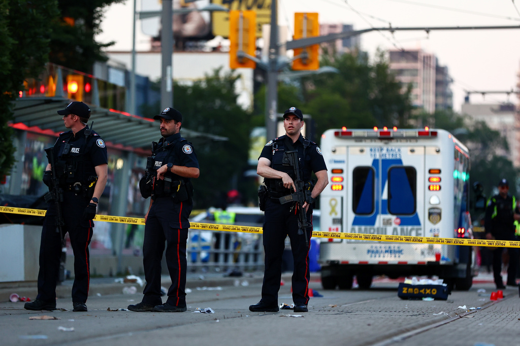 Police respond to an active shooter at the Salsa on St. Clair event in Toronto, Saturday, July 11, 2026. (Keito Newman/The Canadian Press via AP)