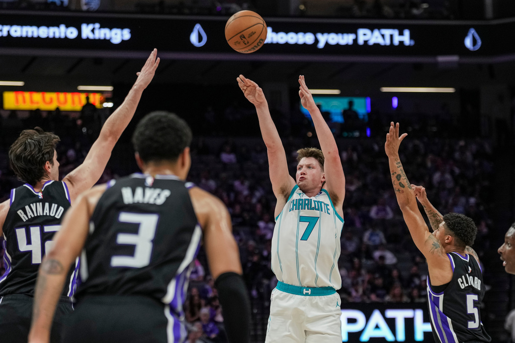 Charlotte Hornets guard Kon Knueppel (7) shoots a three-point basket during the second half of an NBA basketball game against the Sacramento Kings, Wednesday, March 11, 2026, in Sacramento, Calif. (AP Photo/Justine Willard)