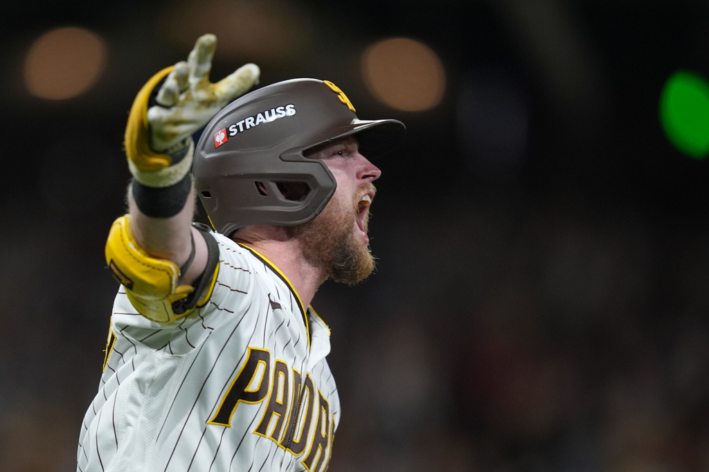 San Diego Padres' Jake Cronenworth celebrates after hitting a solo home run during the fifth inning in Game 3 of baseball's National League Division Series against the Milwaukee Brewers Tuesday, Oct. 6, 2026, in San Diego. (AP Photo/Gregory Bull)