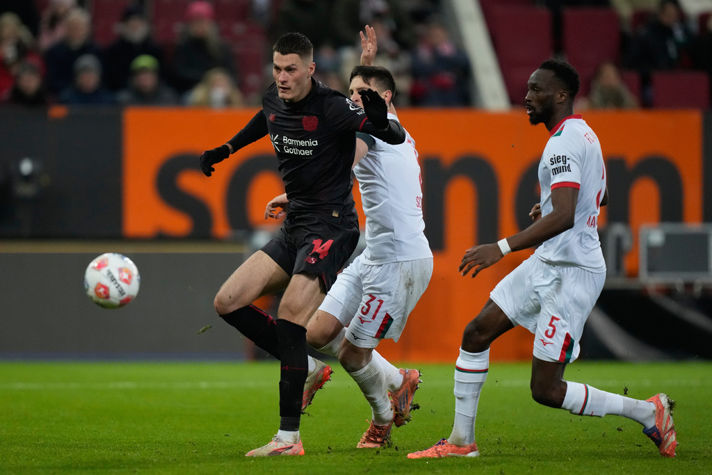 Leverkusen's Patrik Schick misses to score during the Bundesliga soccer match between FC Augsburg and Bayer Leverkusen in Augsburg, Germany, Dec. 6, 2025. (AP Photo/Matthias Schrader)