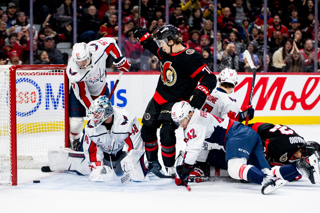 Washington Capitals goalie Logan Thompson (48) watches the puck leave his net on a goal scored by Ottawa Senators' Ridly Grieg (71) during second period NHL hockey action on New Year's Day in Ottawa, on Thursday, Jan. 1, 2026. (Spencer Colby/The Canadian Press via AP)