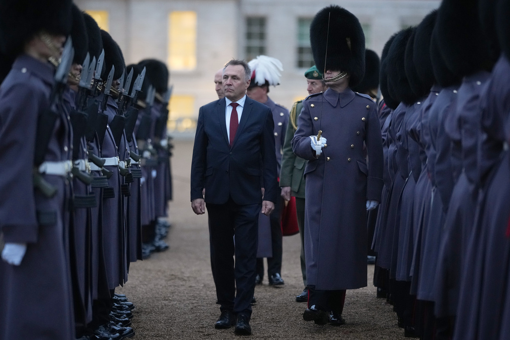 Norway's Minister of Defence Tore O. Sandvik and Britain's Secretary of State for Defence John Healey, behind, inspect a guard of honour in Horse Guards Parade in London, Thursday, Dec. 4, 2025. (AP Photo/Alastair Grant, pool)