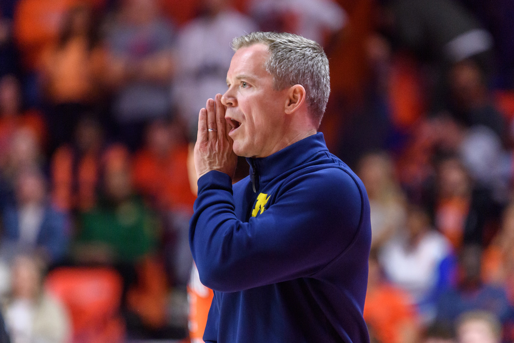 Michigan head coach Dusty May shouts to his team during an NCAA college basketball game against Illinois, Friday, Feb. 27, 2026, in Champaign, Ill. (AP Photo/Craig Pessman)