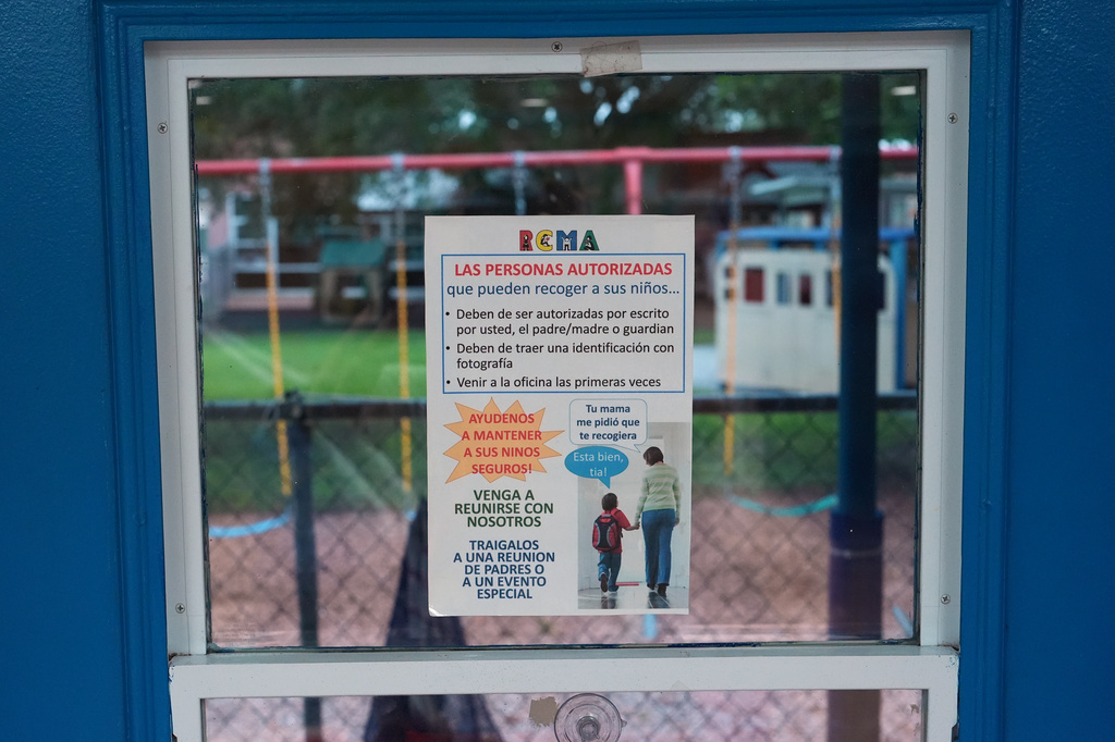 A sign in Spanish advises parents of safety procedures around school pick-up and encourages them to meet with teachers, at a Head Start preschool in Immokalee, Fla., Thursday, Sept. 10, 2026. (AP Photo/Rebecca Blackwell)