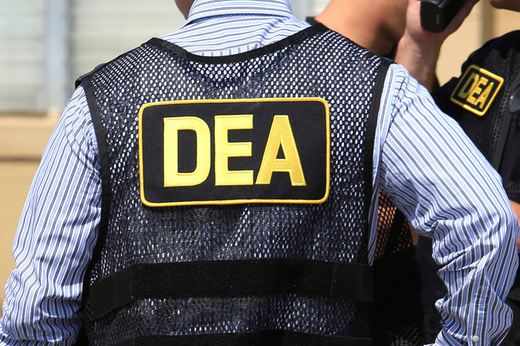 FILE - Lettering marks Drug Enforcement Administration agent's uniforms in Florida, June 13, 2016. (Joe Burbank/Orlando Sentinel via AP, File/Orlando Sentinel via AP, File)
