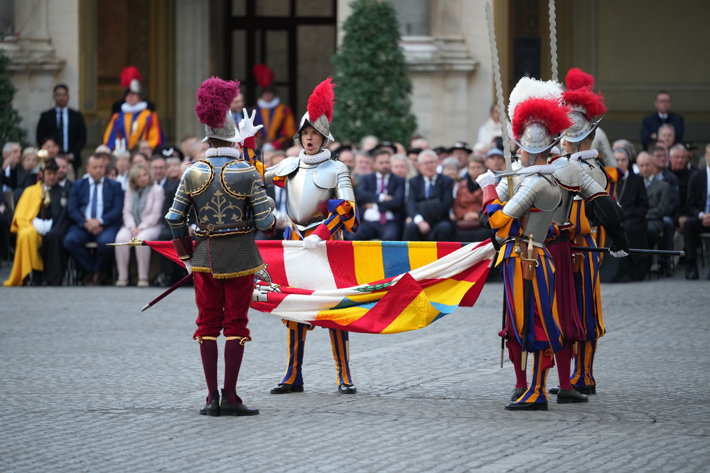 One of 27 cadets of the Pontifical Swiss Guard pronounces the swearing-in oath in the St. Damasus Courtyard at the Vatican, Saturday, Oct. 4, 2025. (AP Photo/Andrew Medichini)