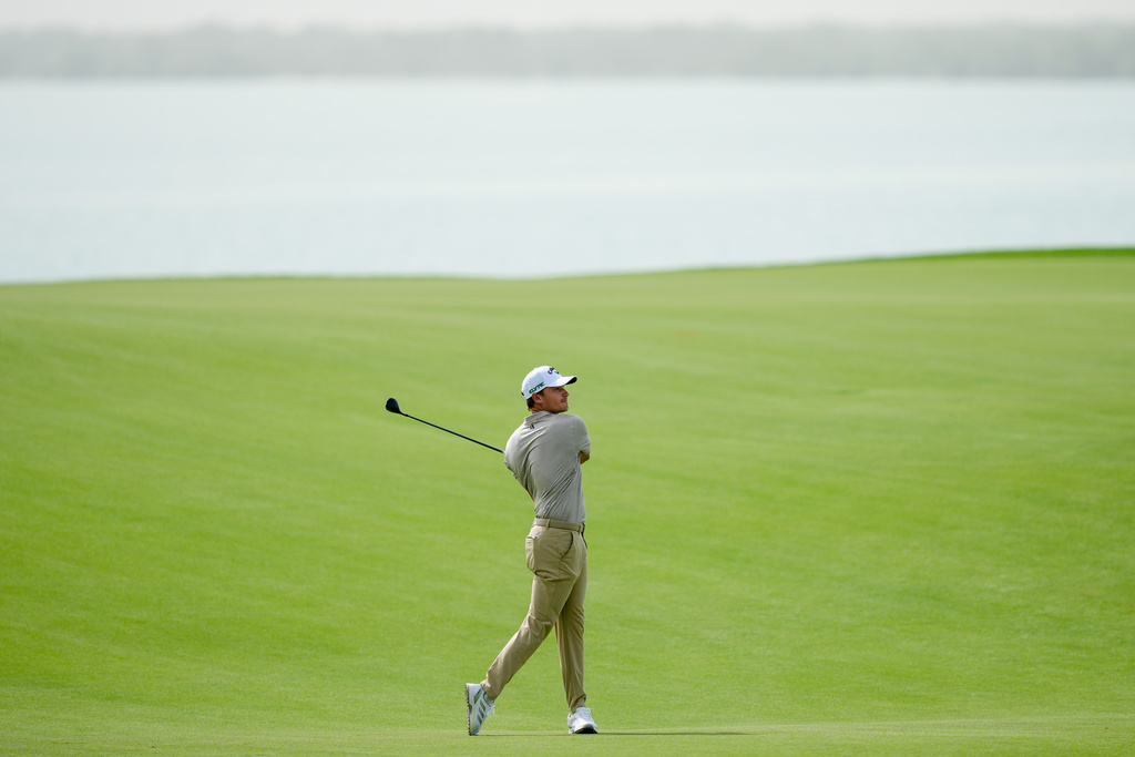 Rasmus Hojgaard of Denmark plays his second shot on the 17th hole during the first round of Abu Dhabi Golf Championship in Abu Dhabi, United Arab Emirates, Thursday, Nov. 6, 2025. (AP Photo/Altaf Qadri)