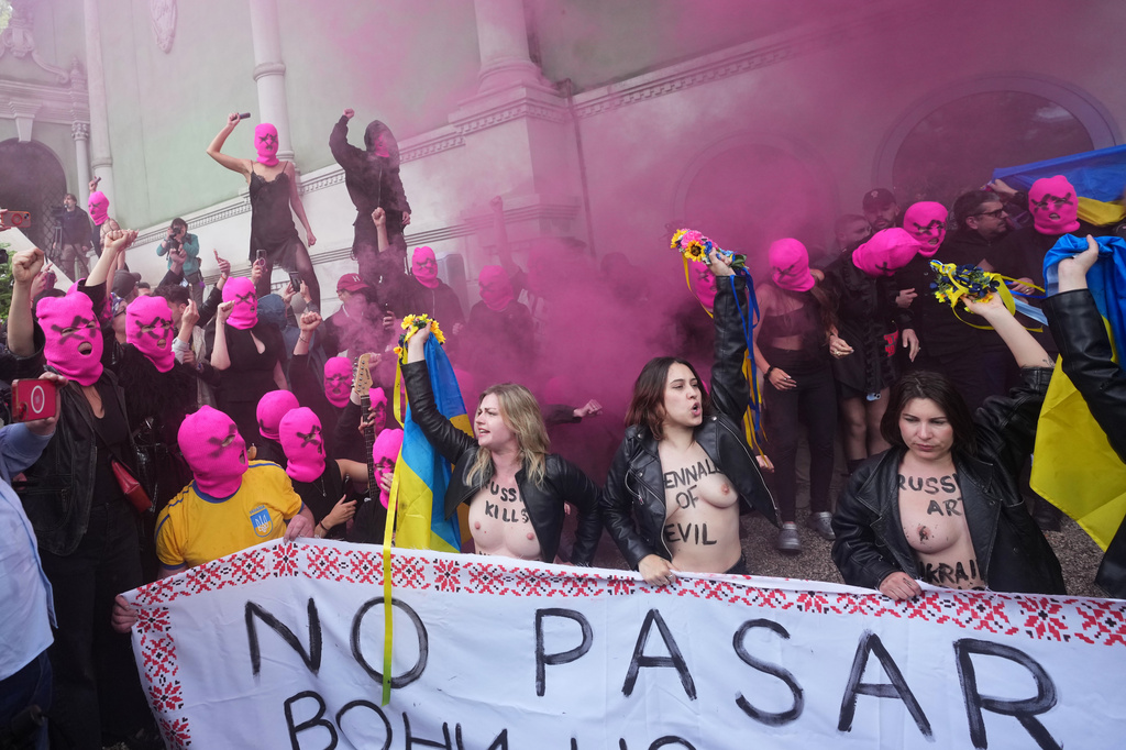 EDS NOTE: NUDITY - Pussy Riot and FEMEN activists stage a protest against Russia's presence after its absence following its 2022 invasion of Ukraine in front of the Russian pavilion, at the 2026 Art Venice Biennale, in Venice, Italy, Wednesday, May 6, 2026. (AP Photo/Luca Bruno)