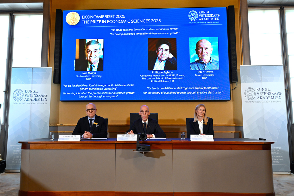Professor John Hassler, from left, Hans Ellegren, Permanent Secretary of the Academy of Sciences and Professor Kerstin Enflo, announce Joel Mokyr, Philippe Aghion and Peter Howitt as the recipients of the Nobel Memorial Prize in Economics during a press conference at the Royal Swedish Academy of Sciences in Stockholm, Sweden, Monday, Oct. 13, 2025. (Anders Wiklund/TT News Agency via AP)