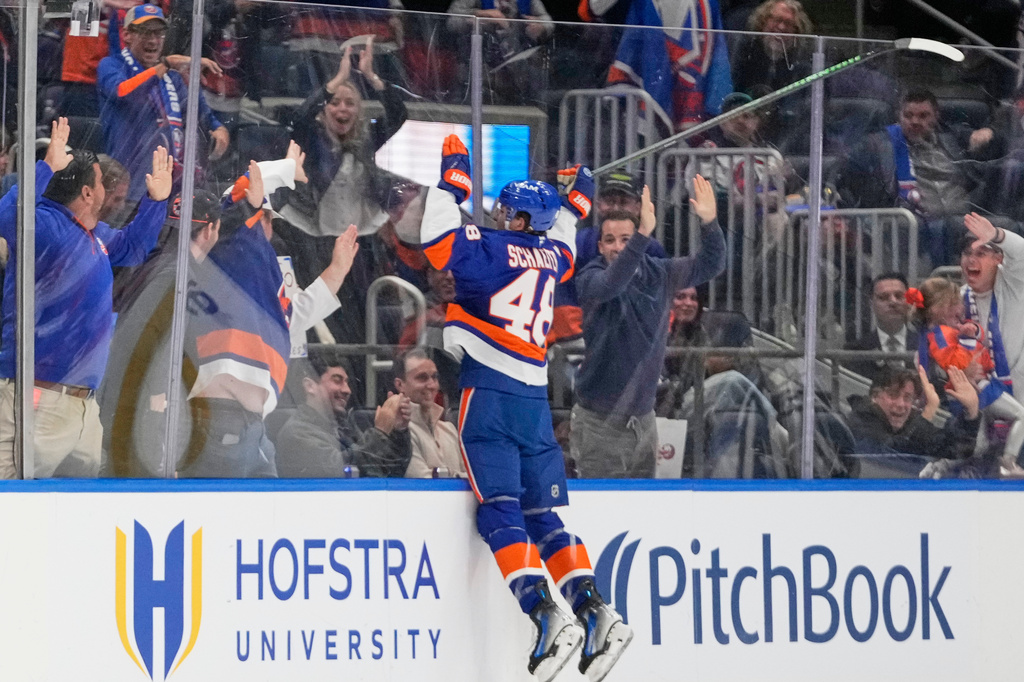 FILE - New York Islanders' Matthew Schaefer (48) celebrates after scoring his first NHL goal during the third period of an NHL hockey game against the Washington Capitals, Oct. 11, 2025, in Elmont, N.Y. (AP Photo/Frank Franklin II, file)