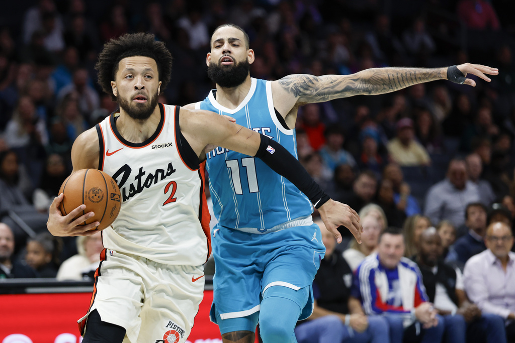 Nell Redmond Detroit Pistons guard Cade Cunningham (2) drives to the basket ahead of Charlotte Hornets forward Cody Martin during the second half of an NBA basketball game in Charlotte, N.C., Thursday, Nov. 21, 2024. (AP Photo/Nell Redmond)