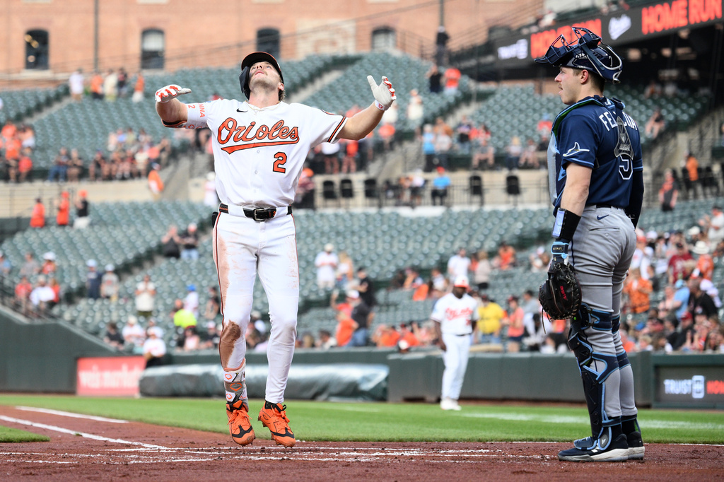 Baltimore Orioles' Gunnar Henderson (2) celebrates his two-run home run in front of Tampa Bay Rays catcher Hunter Feduccia (9) during the first inning of a baseball game, Wednesday, May 27, 2026, in Baltimore. (AP Photo/Nick Wass)