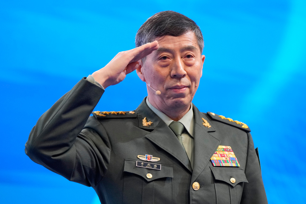 FILE - Chinese Defense Minister Li Shangfu salutes before delivering his speech on the last day of the 20th International Institute for Strategic Studies (IISS) Shangri-La Dialogue, Asia's annual defense and security forum, in Singapore, on June 4, 2023. (AP Photo/Vincent Thian, File)