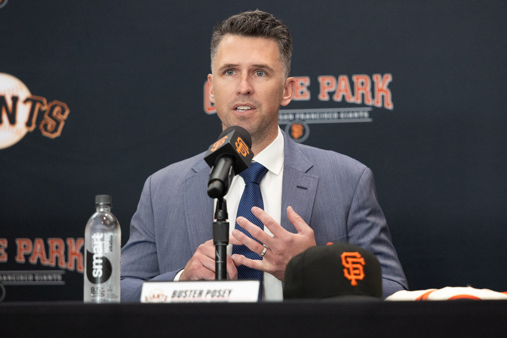 FILE -San Francisco Giants President of Baseball Operations Buster Posey sits during a press conference introducing Tony Vitello as the new manager of the San Francisco Giants baseball team on Oct. 30, 2025, in San Francisco. (AP Photo/Benjamin Fanjoy, File)