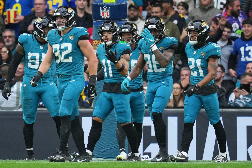 FILE - Jacksonville Jaguars wide receiver Parker Washington (11) reacts after his touchdown was disqualified on a flag during the first half of an NFL football game between the Los Angeles Rams and the Jacksonville Jaguars in London, Sunday, Oct. 19, 2025. (AP Photo/Kin Cheung, File)
