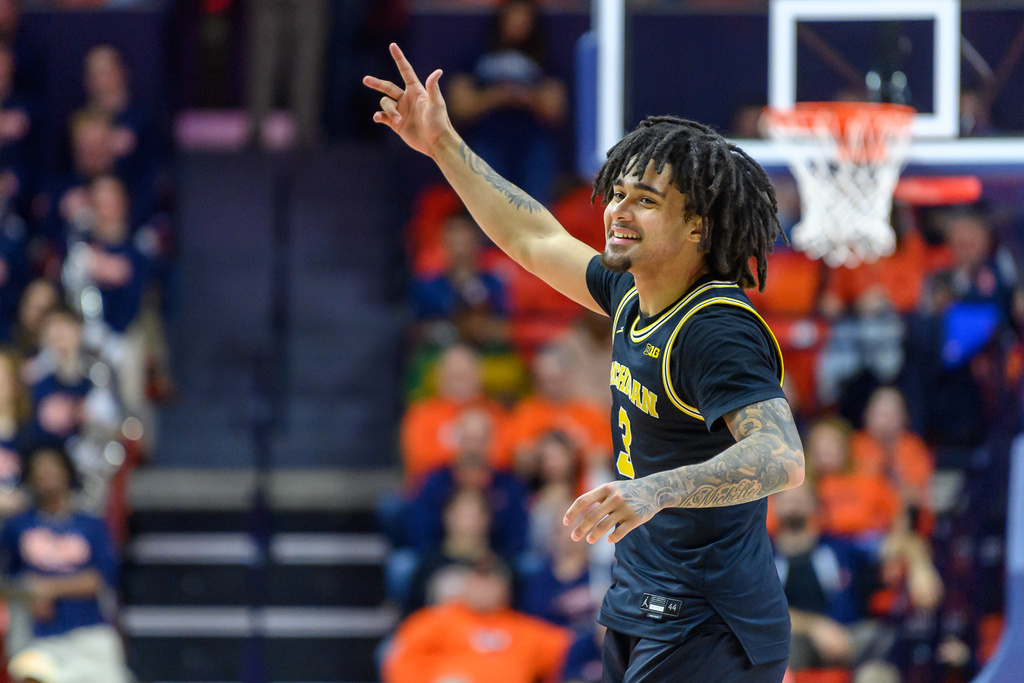 Michigan's Elliot Cadeau celebrates after a win over Illinois during an NCAA college basketball game Friday, Feb. 27, 2026, in Champaign, Ill. (AP Photo/Craig Pessman)