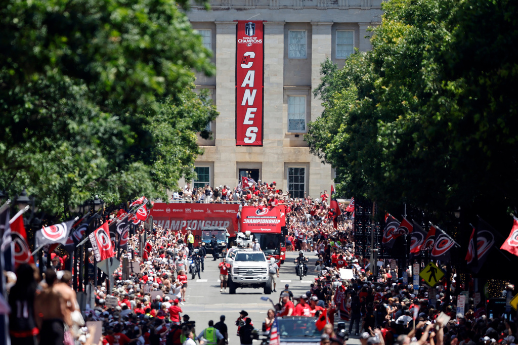 Carolina Hurricanes parade proceeds down Fayetteville Street during the Stanley Cup Championship celebration in Raleigh, N.C., Saturday, June 20, 2026. (AP Photo/Karl DeBlaker)