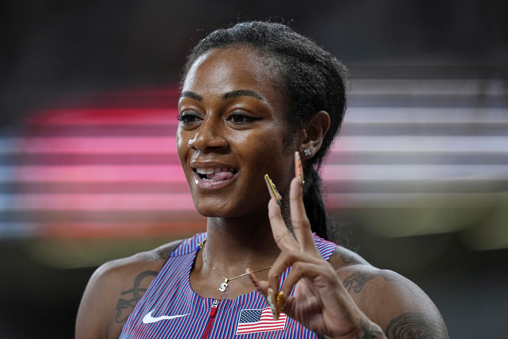 United States' Sha'Carri Richardson gestures after finishing a women's 100 meters heat at the World Athletics Championships in Tokyo, Saturday, Sept. 13, 2025. (AP Photo/Petr David Josek)