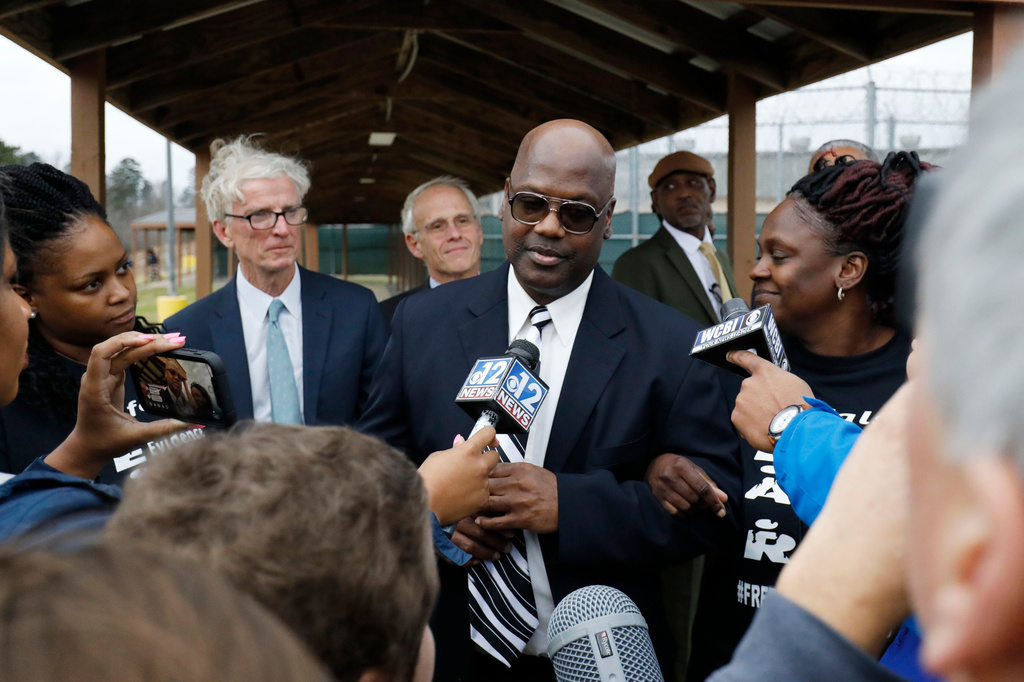 FILE - Curtis Flowers speaks with reporters as he exits the Winston-Choctaw Regional Correctional Facility in Louisville, Miss., Monday, Dec. 16, 2019. (AP Photo/Rogelio V. Solis, File)