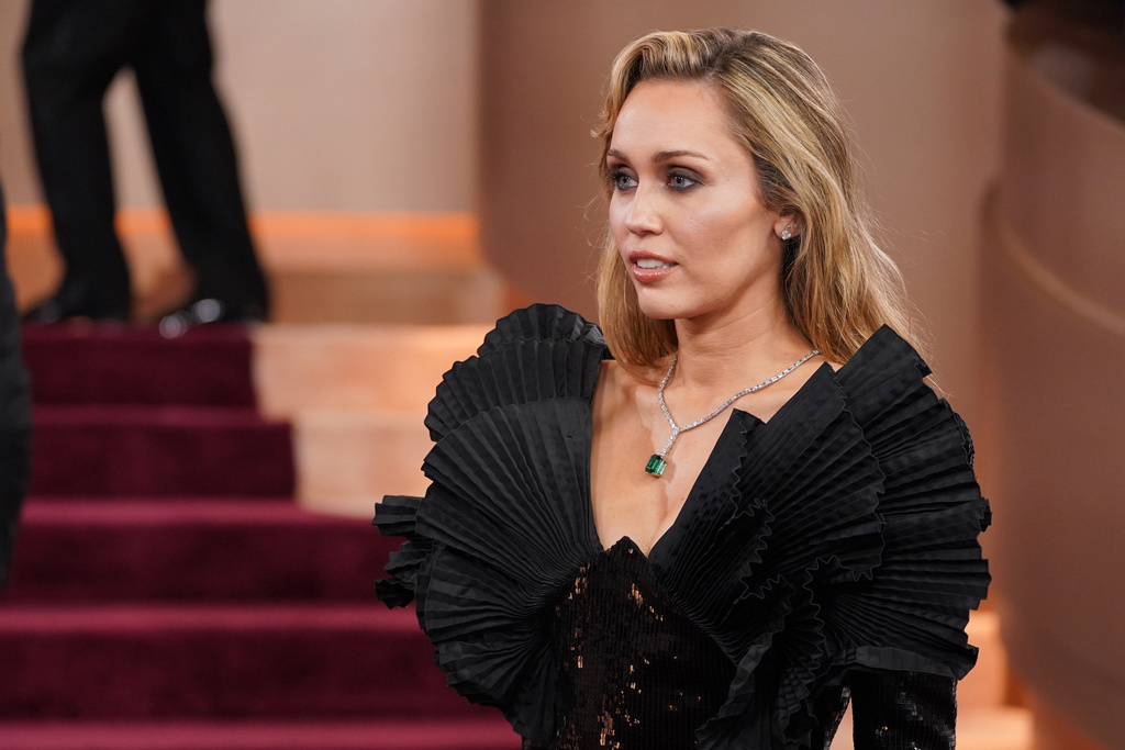 Miley Cyrus arrives at the 83rd Golden Globes on Sunday, Jan. 11, 2026, at the Beverly Hilton in Beverly Hills, Calif. (Photo by Jordan Strauss/Invision/AP)