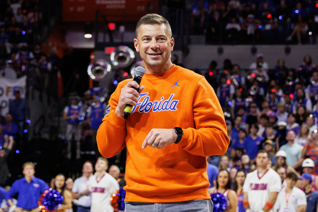 FILE - Florida football head coach Jon Sumrall addresses the crowd during the first half of an NCAA college basketball game against Auburn, Jan. 24, 2026, in Gainesville, Fla. (AP Photo/Chris Watkins, File)