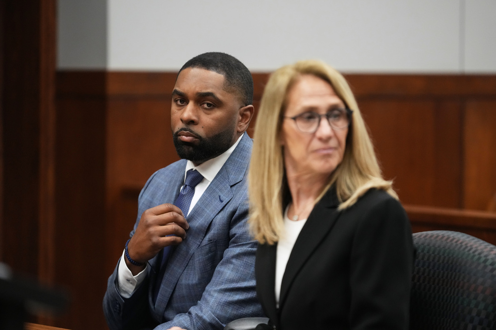 Former Michigan football coach Sherrone Moore appears in court with his attorney Ellen Michaels, Tuesday, April 14, 2026, in Ann Arbor, Mich. (AP Photo/Paul Sancya)