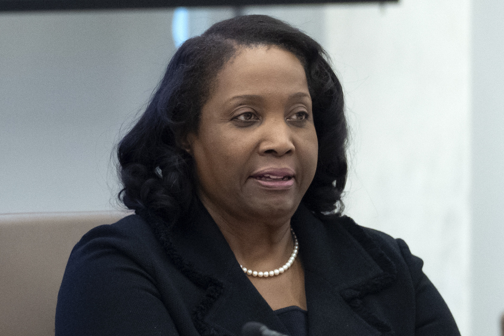 FILE - Federal Reserve Board of Governors member Lisa Cook listens during an open meeting of the Board of Governors at the Federal Reserve, June 25, 2025, in Washington. (AP Photo/Mark Schiefelbein, File)