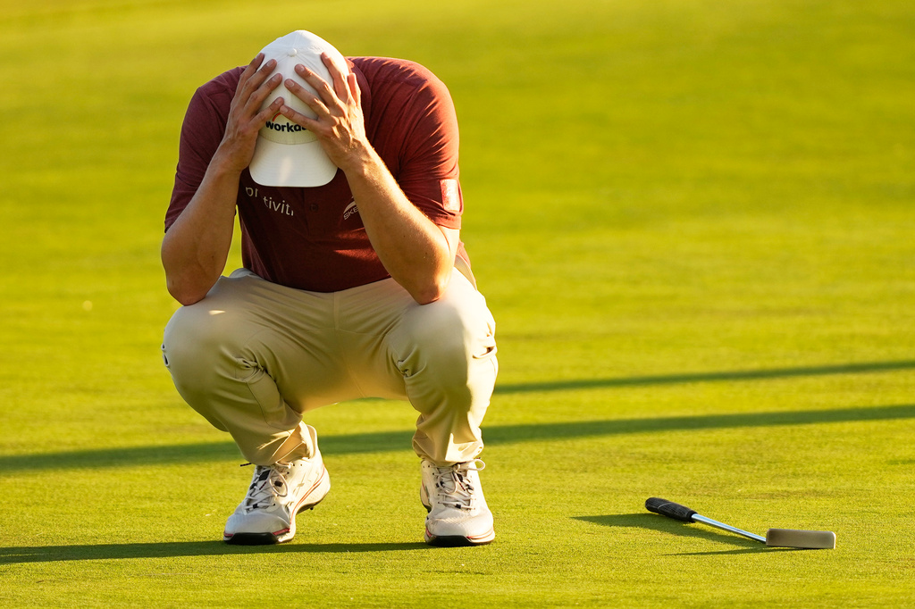 Matthew Fitzpatrick, of England, reacts after missing a putt on the 16th hole during the third round of the U.S. Open golf tournament at Shinnecock Hills Golf Club in Southampton, N.Y., Saturday, June 20, 2026. (AP Photo/Gerald Herbert)