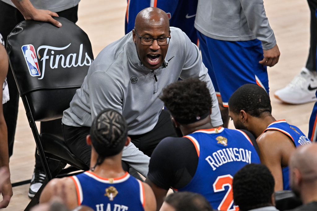 New York Knicks head coach Mike Brown talks with his team during a time out during the first half of Game 5 of the NBA Finals basketball series against the San Antonio Spurs, Saturday, June 13, 2026, in San Antonio. (AP Photo/Darren Abate)