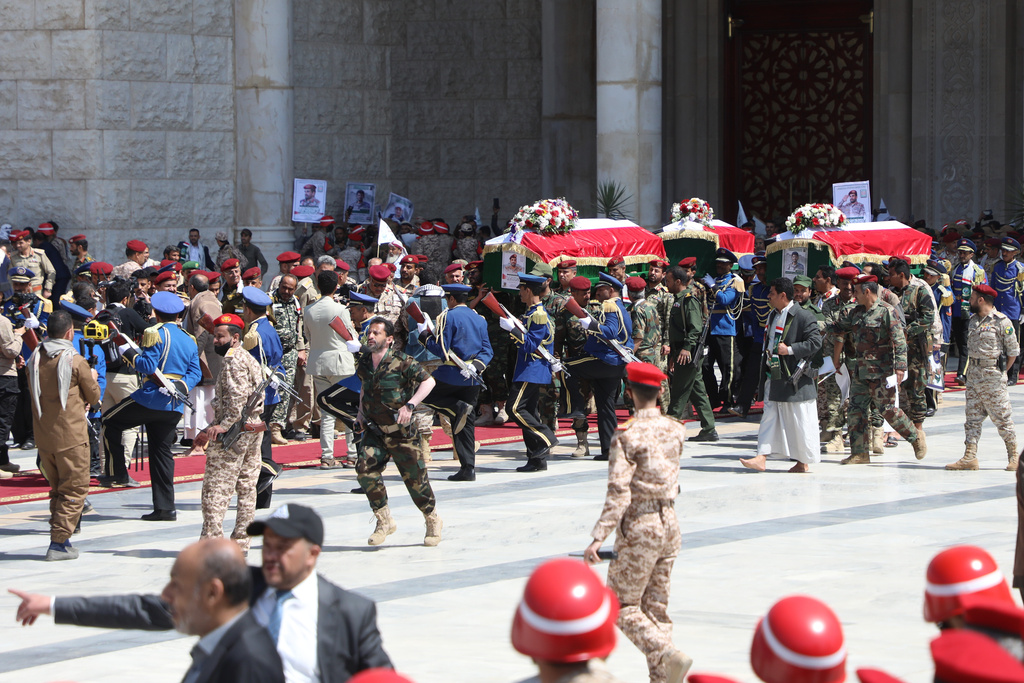 Houthi supporters carry the coffin of Maj. Gen. Muhammad Abdul Karim al-Ghamari, right, who died after Israeli attack, and three others during the funeral at the people's mosque in Sanaa, Yemen, Monday, Oct. 20, 2025. (AP Photo/Osamah Abdulrahman)