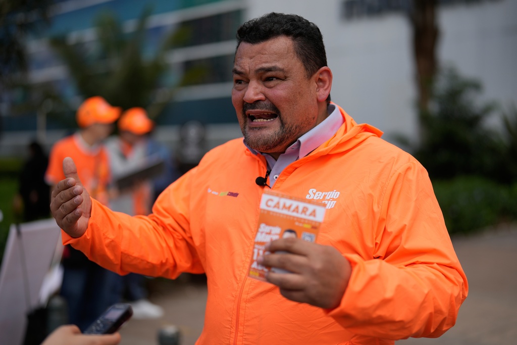 Congressman Carlos Carreño Marín, who goes by Sergio Marin, of the Comunes party, gives an interview while campaigning for reelection ahead of legislative elections in Bogota, Colombia, Thursday, Feb. 26, 2026. (AP Photo/Fernando Vergara)