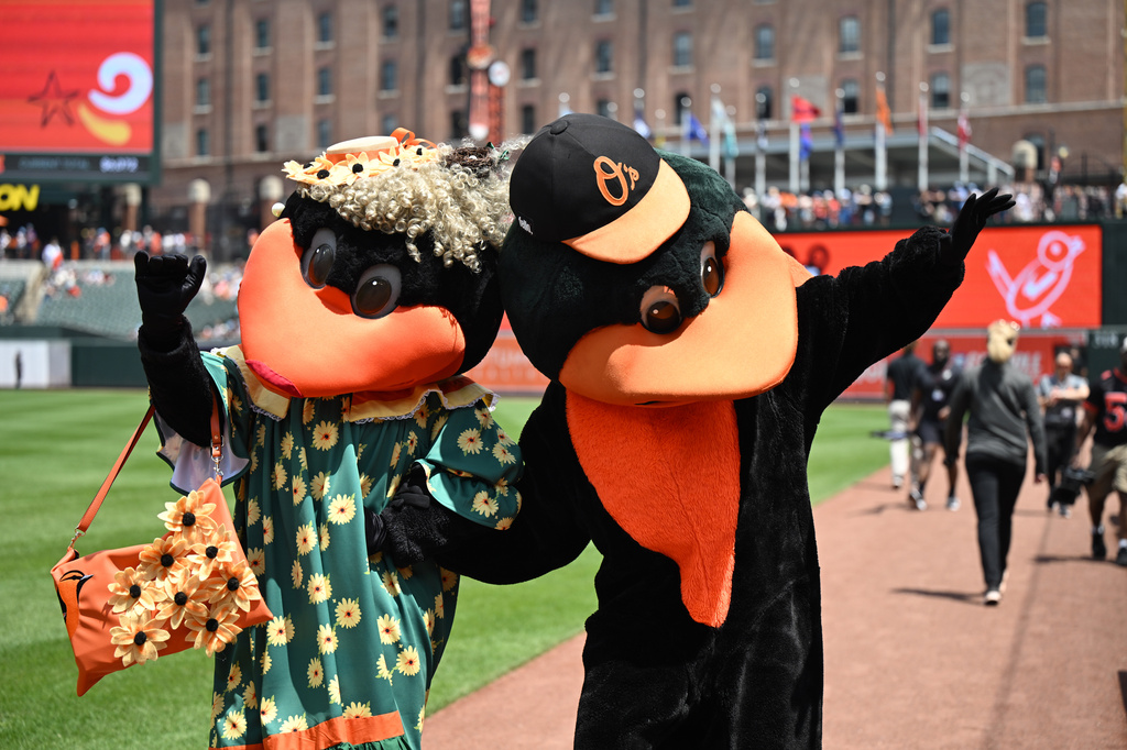 The Baltimore Orioles mascot, right, the Oriole Bird, greets baseball fans with Mama Bird, left, for Mother's Day before a baseball game against the Athletics, Sunday, May 10, 2026, in Baltimore. (AP Photo/Steve Ruark)