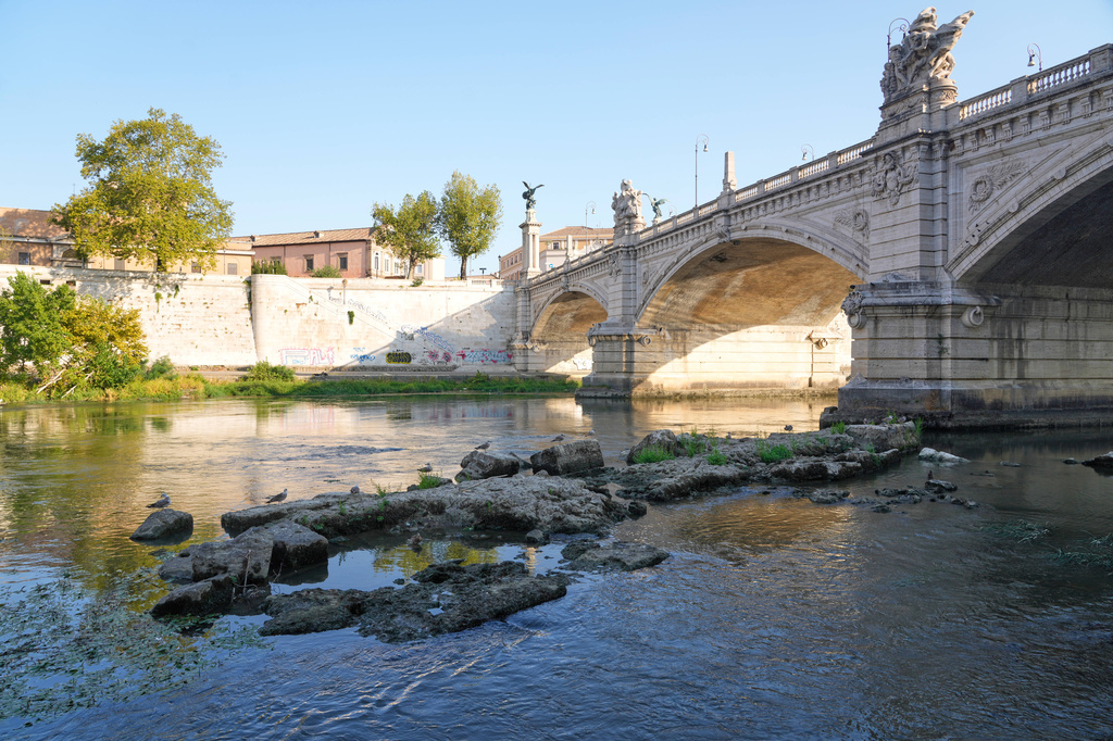 The ruins of the ancient Roman Neronian bridge, emerge from the riverbed of the Tiber river due to drought, in Rome, Thursday, Aug. 13, 2026. (AP Photo/Gregorio Borgia)