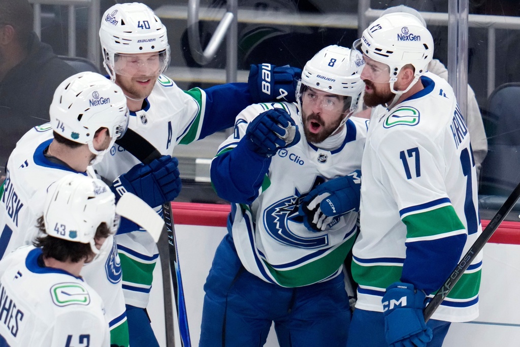 Vancouver Canucks' Conor Garland (8) celebrates his goal during the first period of an NHL hockey game against the Pittsburgh Penguins in Pittsburgh, Tuesday, Oct. 21, 2025. (AP Photo/Gene J. Puskar)