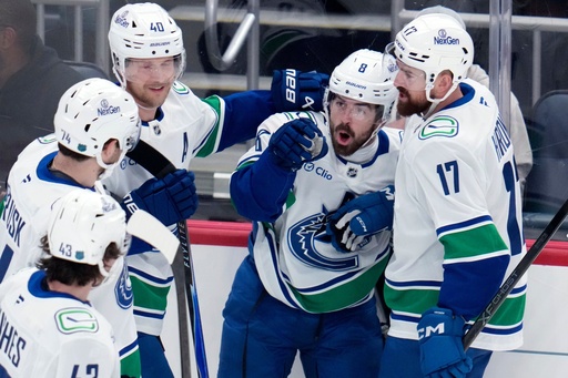 Vancouver Canucks' Conor Garland (8) celebrates his goal during the first period of an NHL hockey game against the Pittsburgh Penguins in Pittsburgh, Tuesday, Oct. 21, 2025. (AP Photo/Gene J. Puskar) Vancouver Canucks' Conor Garland (8) celebrates his goal during the first period of an NHL hockey game against the Pittsburgh Penguins in Pittsburgh, Tuesday, Oct. 21, 2025. (AP Photo/Gene J. Puskar)