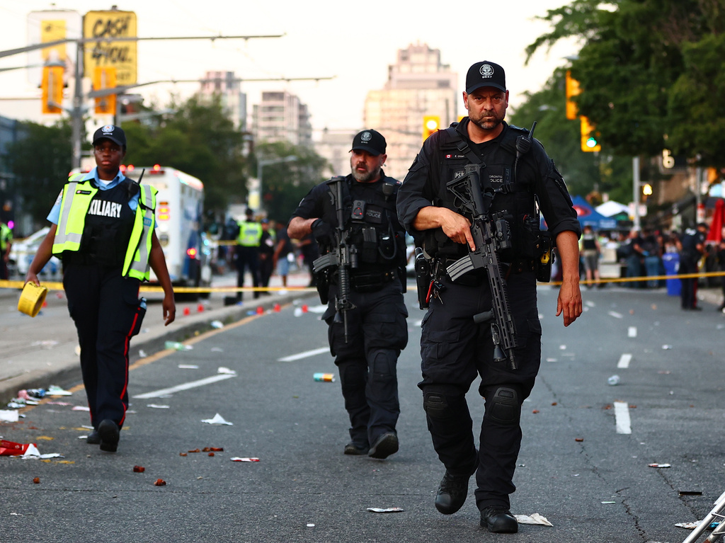 Police respond to an active shooter at the Salsa on St. Clair event in Toronto, Saturday, July 11, 2026. (Keito Newman/The Canadian Press via AP)