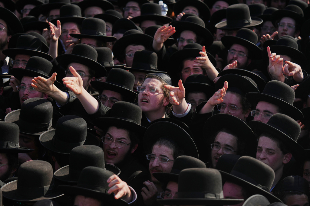 Ultra-Orthodox Jewish men protest against military recruitment and call for the release of detained draft resisters outside a military prison near Kfar Yona, Israel, Wednesday, June 17, 2026. (AP Photo/Ariel Schalit)