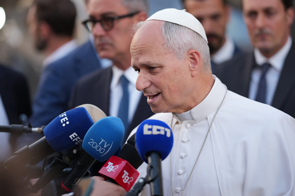 Pope Leo XIV greets people as he leaves his residence in Castel Gandolfo, on the outskirts of Rome, to return to the Vatican, Tuesday, June 16, 2026. (AP Photo/Andrew Medichini)