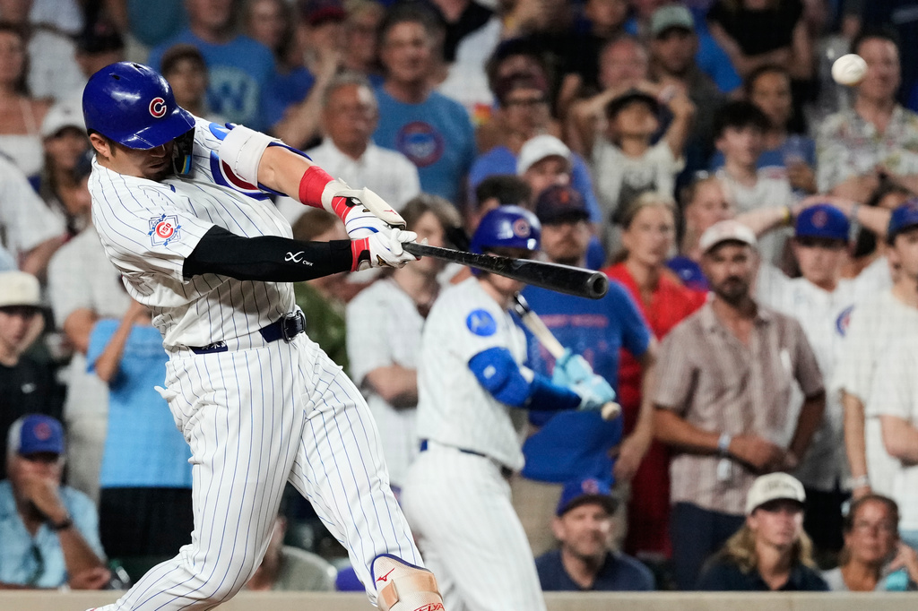Chicago Cubs' Seiya Suzuki of Japan, hits a walk-off one-run single during the ninth inning of a baseball game against the San Diego Padres in Chicago, Monday, June 29, 2026. (AP Photo/Nam Y. Huh)