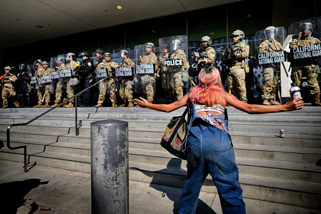 FILE - A protester taunts a line of California National Guard protecting a federal building in downtown Los Angeles on June 9, 2025. (AP Photo/Eric Thayer, File)