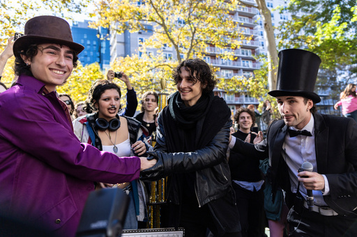FILE - Miles Mitchell, left and Zander Dueve, center, shake hands at the Timothee Chalamet lookalike contest in New York on Oct. 27, 2024. (AP Photo/Stefan Jeremiah, File) FILE - Miles Mitchell, left and Zander Dueve, center, shake hands at the Timothee Chalamet lookalike contest in New York on Oct. 27, 2024. (AP Photo/Stefan Jeremiah, File)