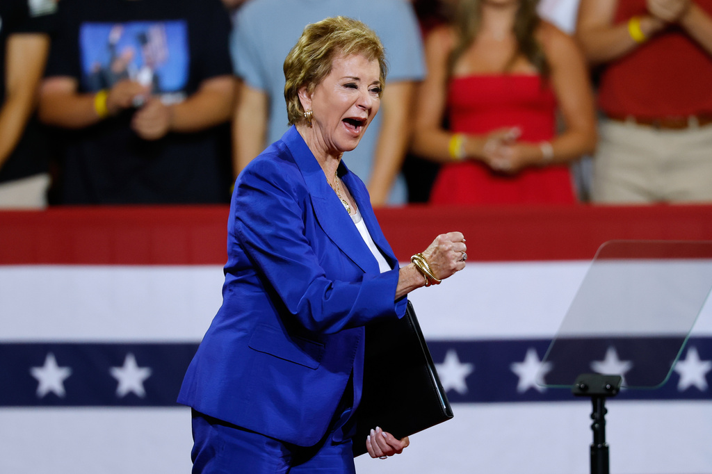 Secretary of Education Linda McMahon, steps on stage to speak before President Donald Trump arrives at Wheeler High School in Marietta, Ga., Wednesday, July 22, 2026. (AP Photo/Erik S. Lesser)