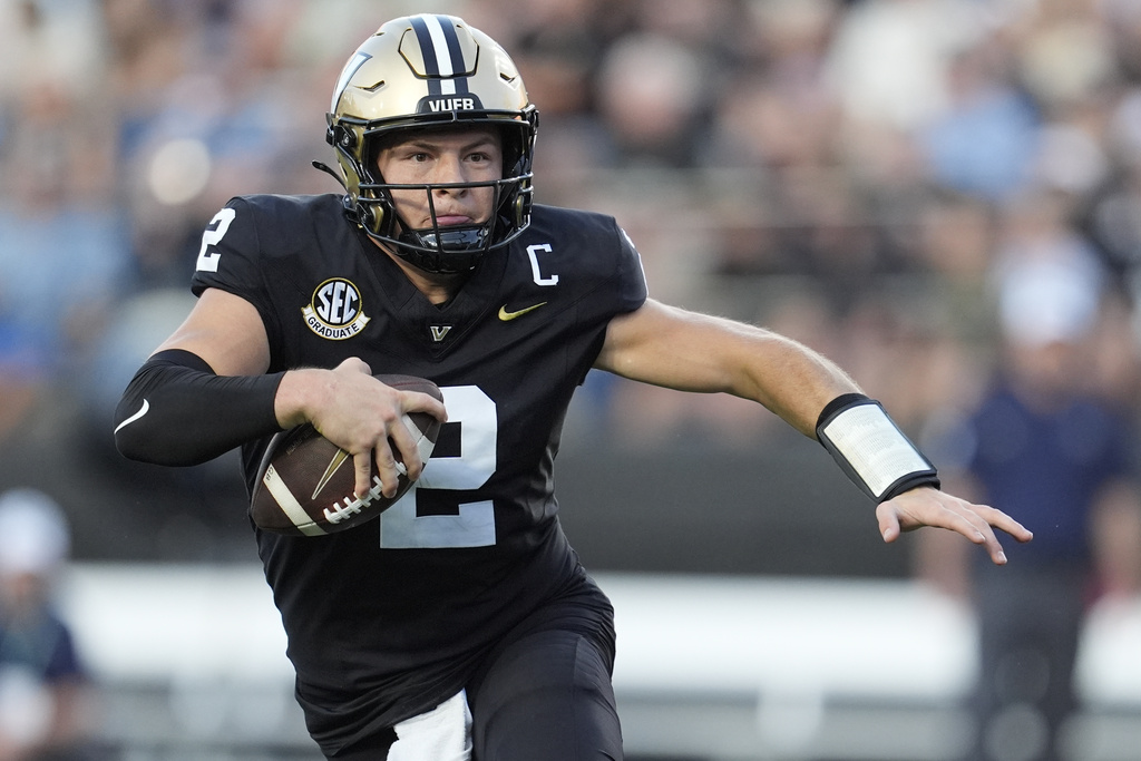 Vanderbilt quarterback Diego Pavia (2) runs the ball during the first half of an NCAA college football game against Charleston Southern, Saturday, Aug. 30, 2025, in Nashville, Tenn. (AP Photo/George Walker IV)