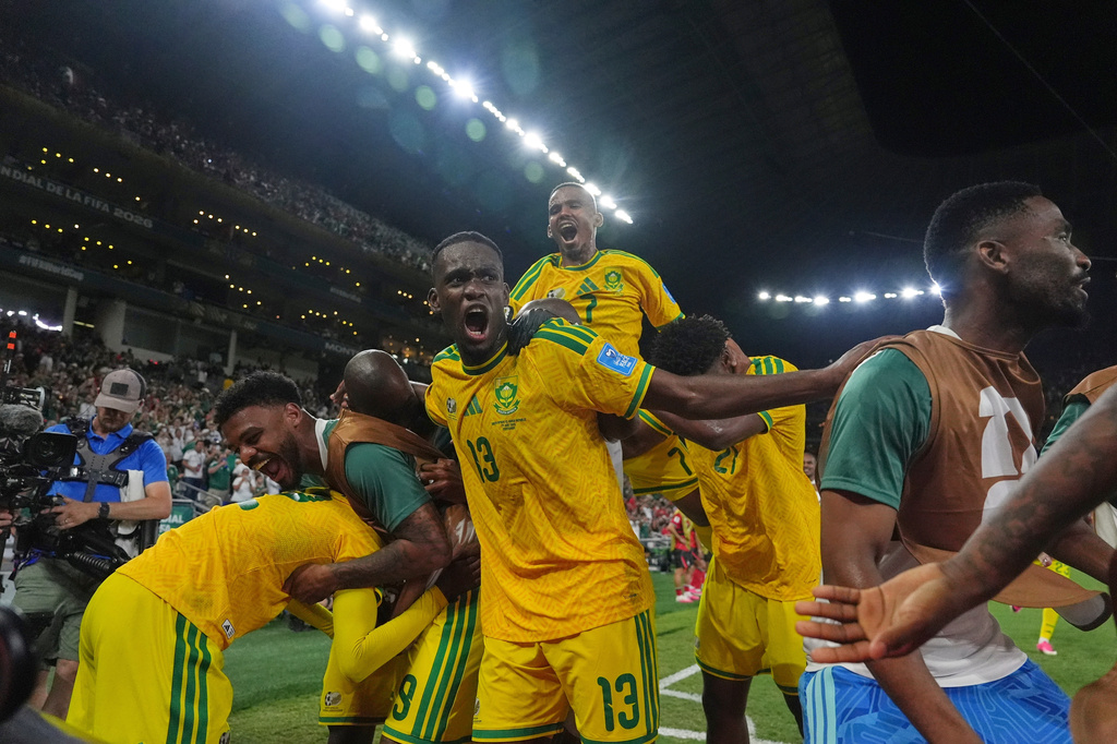 South Africa's Thapelo Maseko (12) celebrates with teammates after scoring his side's first goal during the World Cup Group A soccer match between South Africa and South Korea in Guadalupe, near Monterrey, Mexico, Wednesday, June 24, 2026. (AP Photo/Moises Castillo)