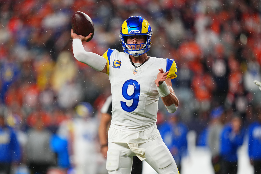 Los Angeles Rams quarterback Matthew Stafford throws a touchdown pass against the Denver Broncos during the first half of an NFL football game Sunday, Sept. 27, 2026, in Denver. (AP Photo/Jack Dempsey)