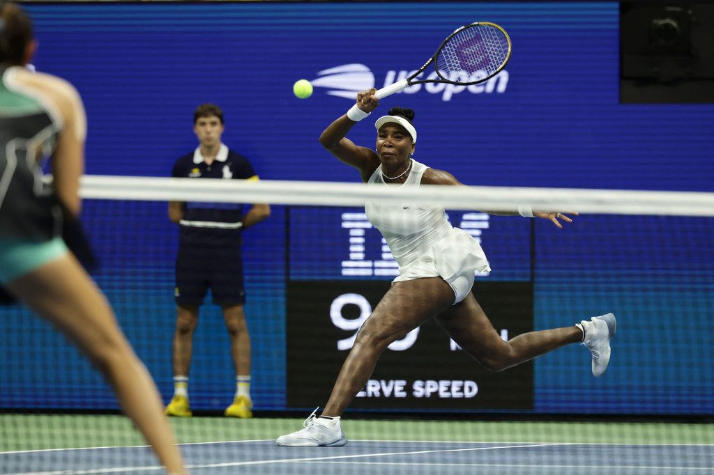 Venus Williams, of the United States, hits a return as she plays a women's doubles match with partner Serena Williams against Hao-Ching Chan, of Taiwan, and Maya Joint, at the U.S. Open tennis championships, Friday, Sept. 4, 2026, in New York. (AP Photo/Adam Hunger)