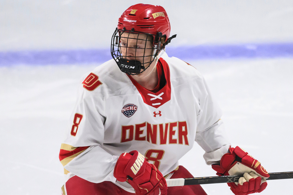 FILE - Denver Pioneers forward Kristian Epperson (8) skates during the first period of an NCAA hockey regional game against Cornell, March 27, 2026, in Loveland, Co. (AP Photo/Tyler Tate, File)